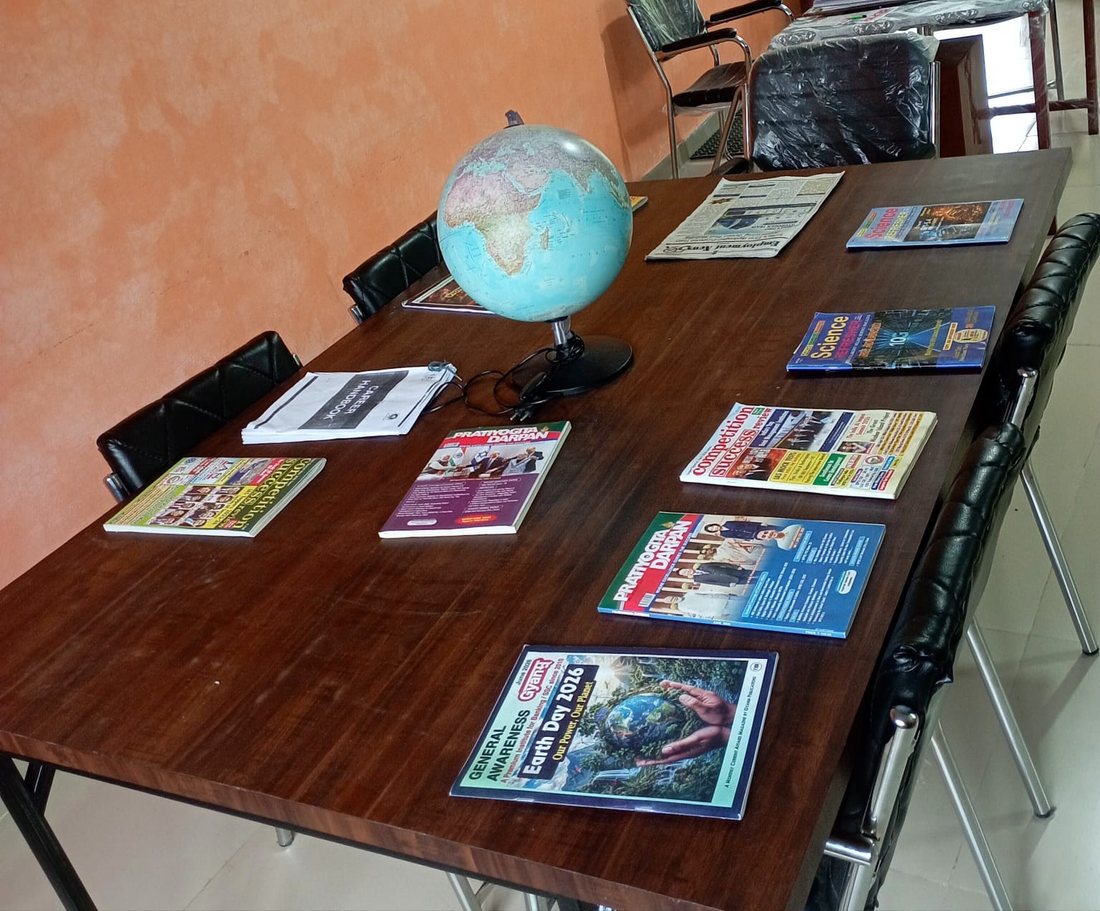 The reading table, with globe and magazines