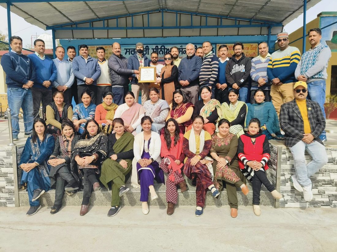School staff with the Best School Award