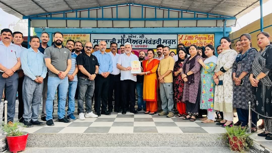 Staff receiving an award at the school