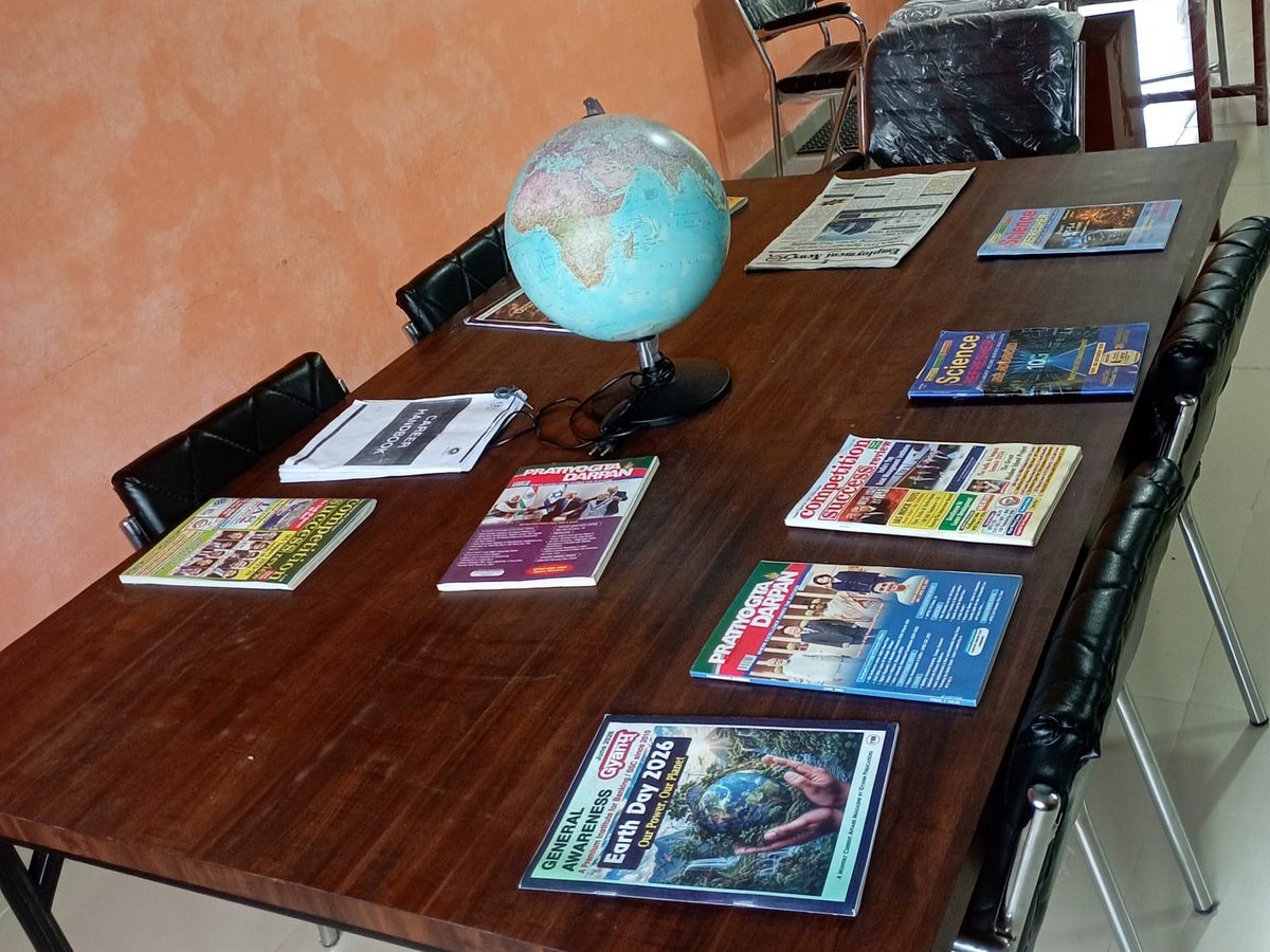 Reading table with a globe and current magazines